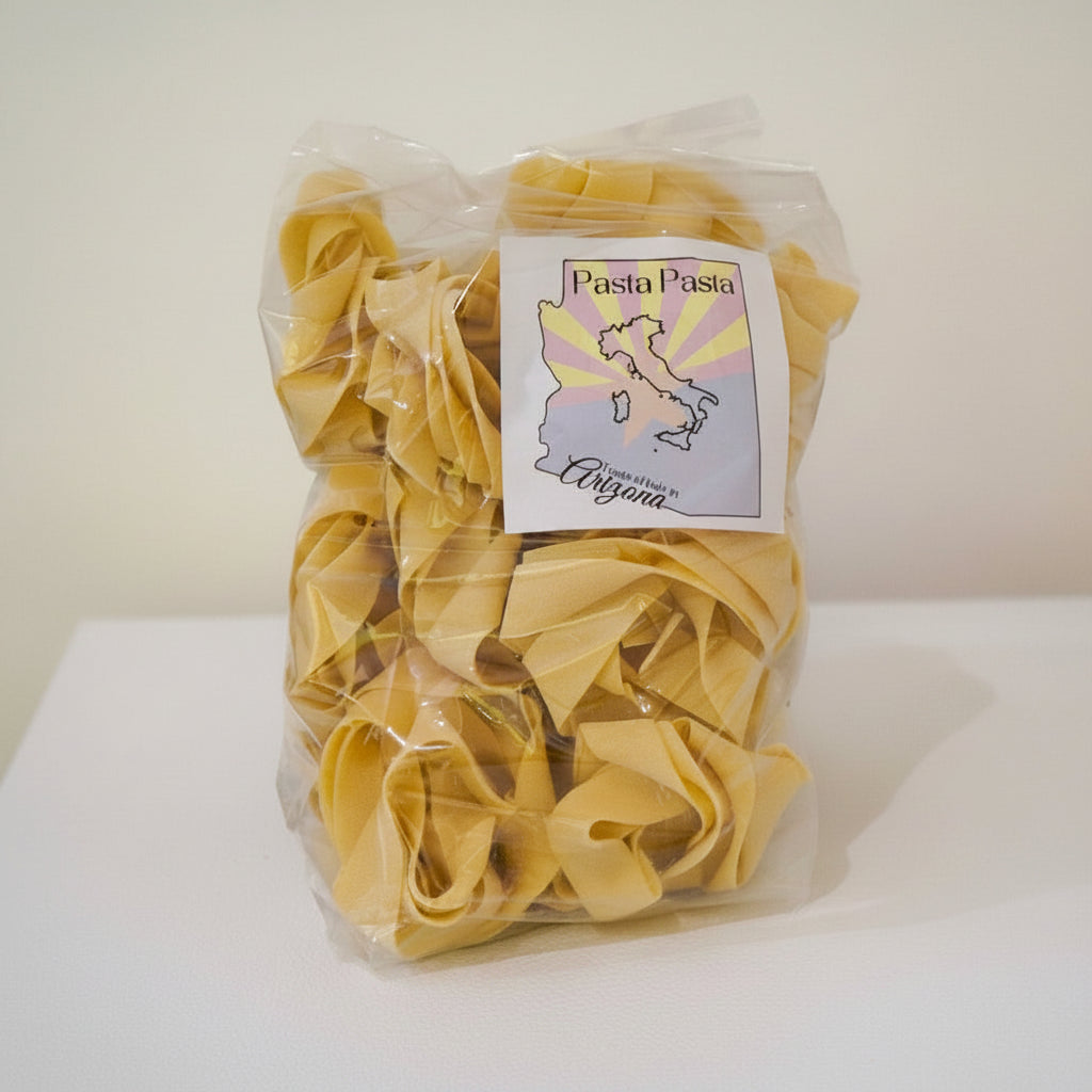 Packaged pasta with a label on a white surface
