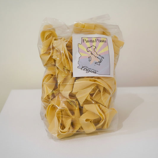 Packaged pasta with a label on a white surface